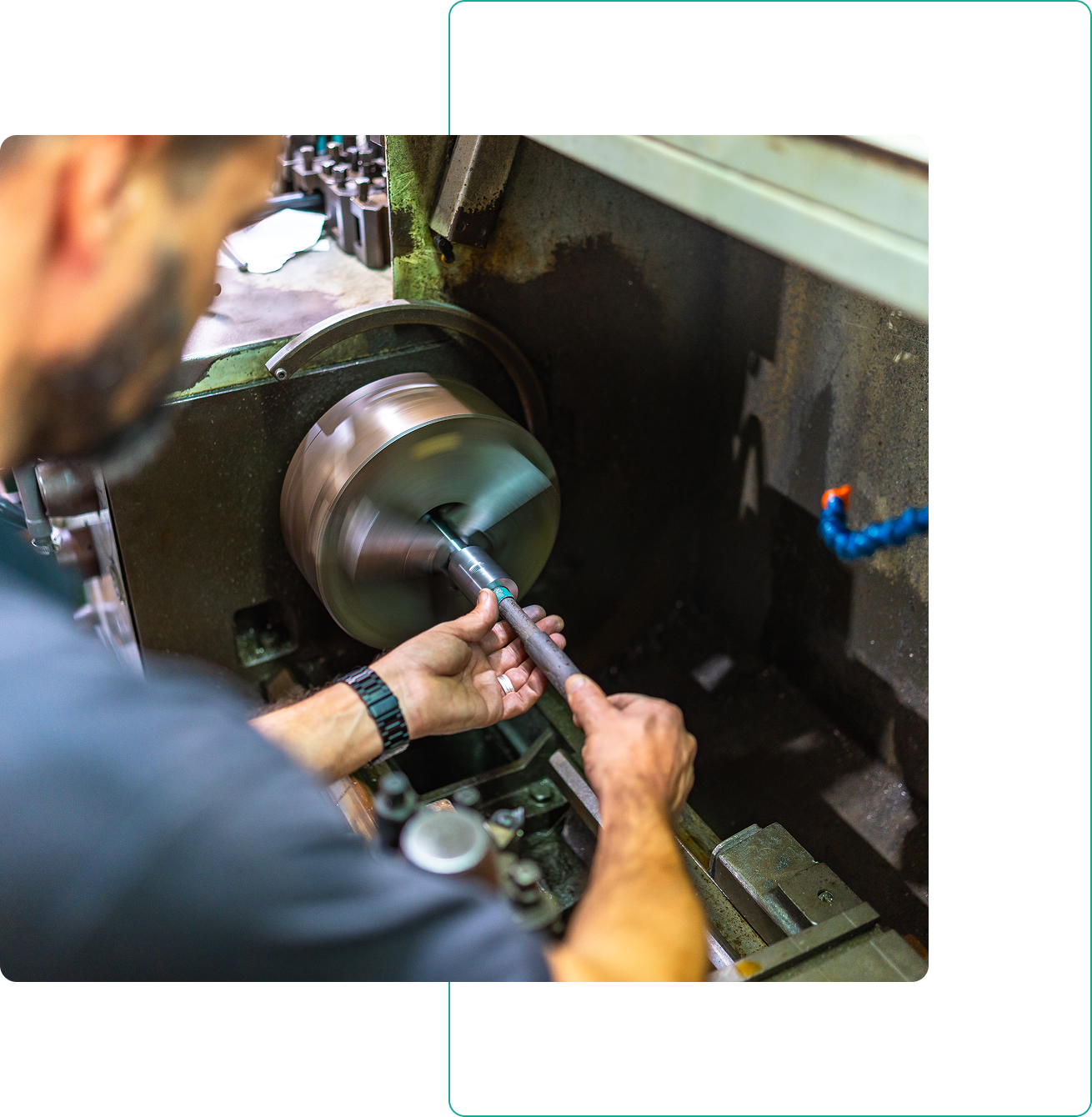 Metalworker operating a lathe machine