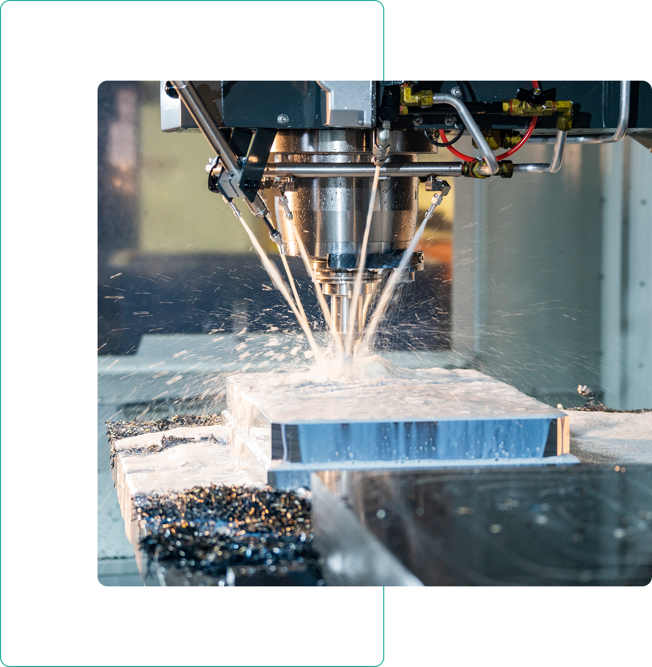 CNC machine cutting metal with coolant spray