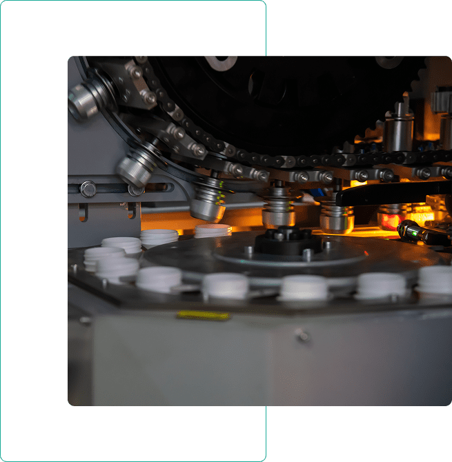 Industrial machine with rotating components and lights.