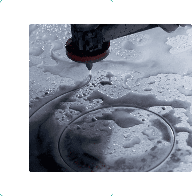 Waterjet cutting through a wet surface.