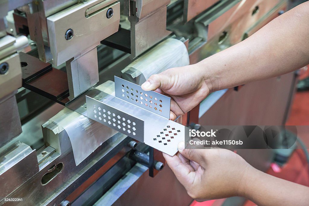 Worker at manufacture workshop operating cidan folding machine